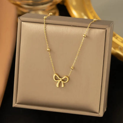 Golden Bow Pendant Necklace – Beaded Chain