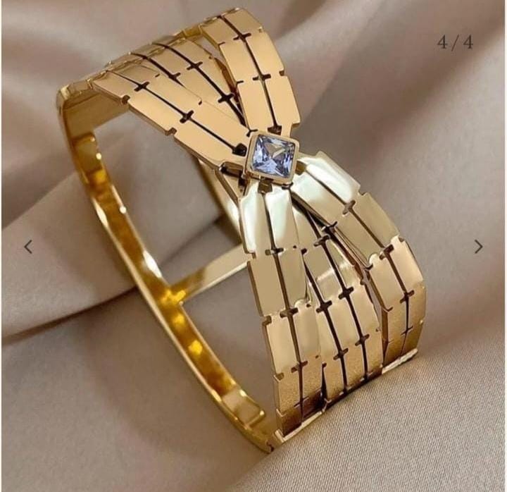 Gold Bow Bangle with Gemstone Center