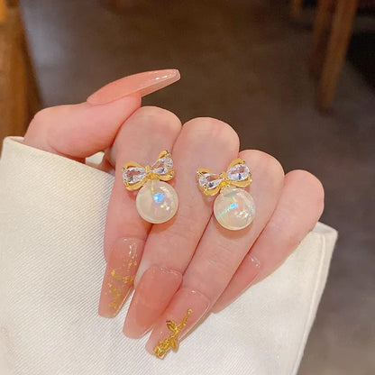 Gold Bow Earrings with Pearl Drops
