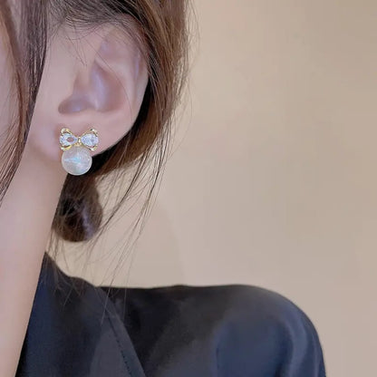 Gold Bow Earrings with Pearl Drops