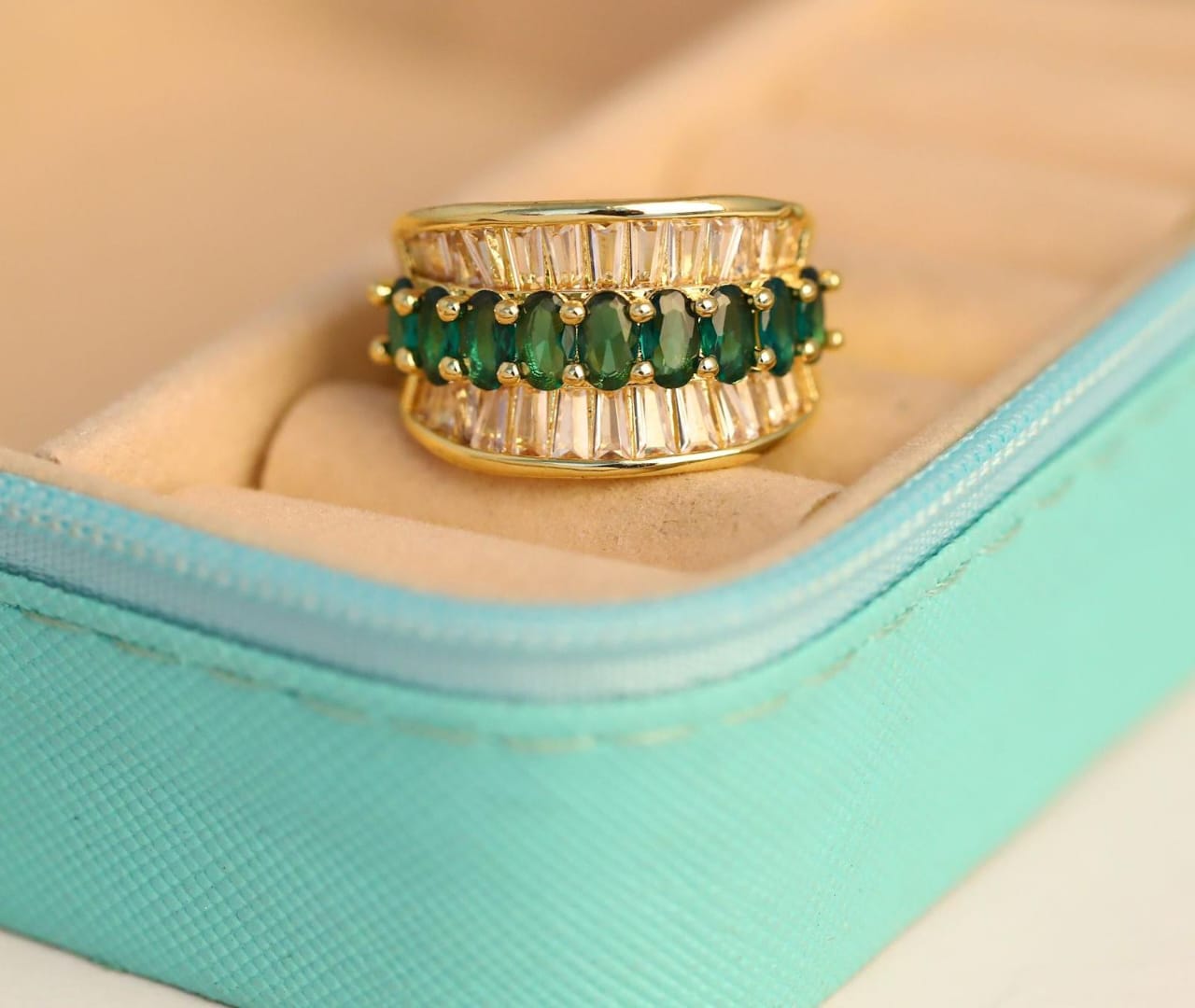 Gold Ring with Emerald Accents