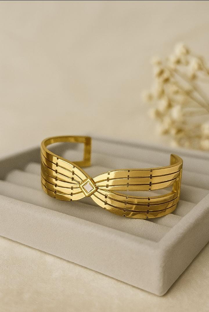 Gold Bow Bangle with Gemstone Center