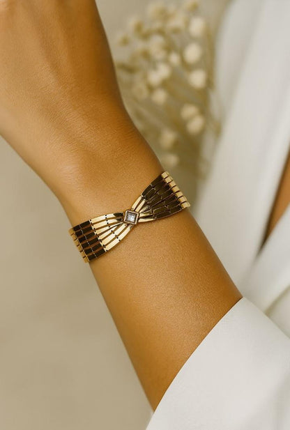 Gold Bow Bangle with Gemstone Center